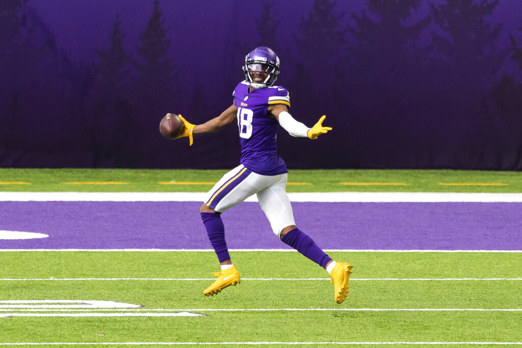 Minnesota Vikings wide receiver Justin Jefferson (18) celebrates after catching a touchdown pass in the third quarter during an NFL football game against the Tennessee Titans, Sunday, Sept. 27, 2020, in Minneapolis. The Titans defeated the Vikings 31-20. (AP Photo/David Berding)