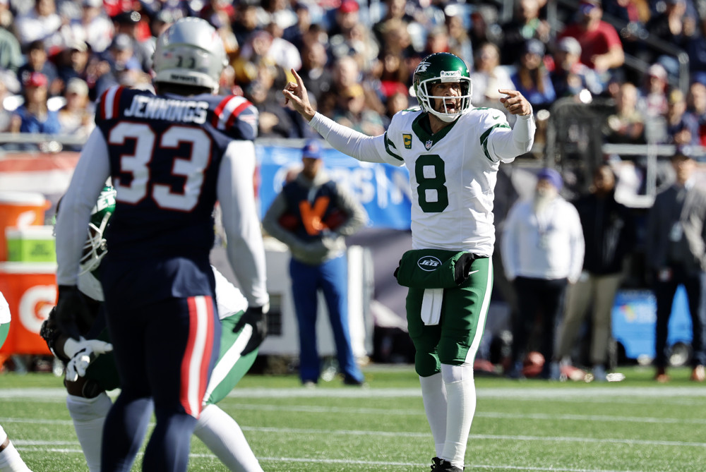 FOXBOROUGH, MA - OCTOBER 27: New York Jets quarterback Aaron Rodgers (8) directs a receiver during a game between the New England Patriots and the New York Jets on October 27, 2024, at Gillette Stadium in Foxborough, Massachusetts. (Photo by Fred Kfoury III/Icon Sportswire)
